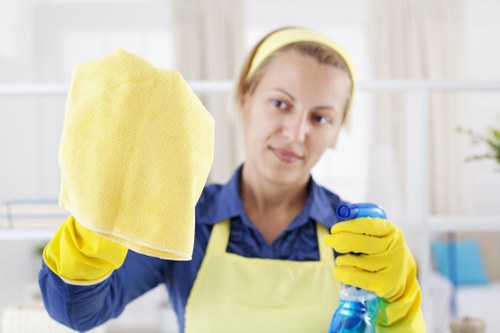 Training-focused cleaning operative following health and safety practices